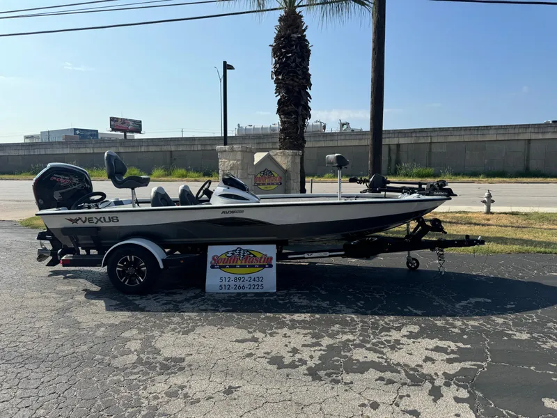 Slide: The Image of 2025 Vexus AVX 1880 boat on trailer, parked outdoors, sunny day. - 43