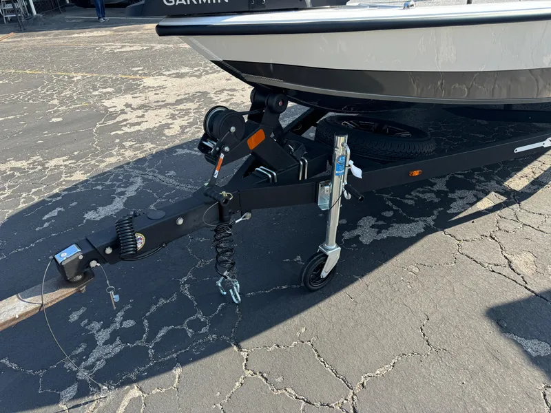 Slide: The Image of 2025 Vexus AVX 1880 boat trailer hitch and wheel on asphalt. - 6