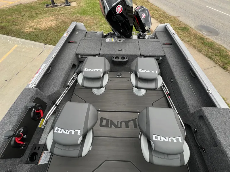 Slide: The Image of 2025 Lund 2075 IMPACT XS boat interior with seating and motor. - 10