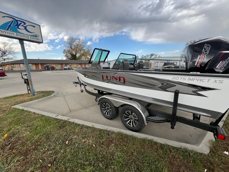 Slide: The Image of 2025 Lund 2075 IMPACT XS boat on trailer at Premier Boating Center. - 14