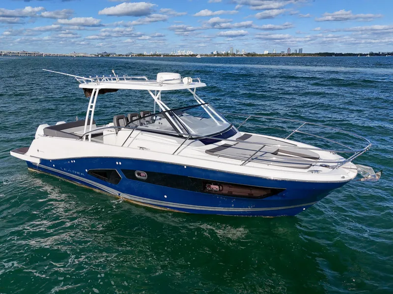 Slide: The Image of 2019 Jeanneau 34 boat cruising on open water under a clear sky. - 1