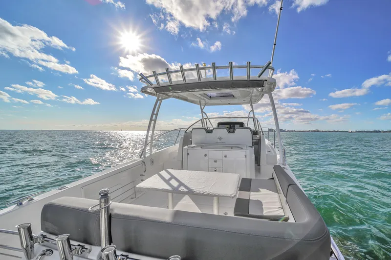 Slide: The Image of 2019 Jeanneau 34 boat on open water under sunny sky. - 18