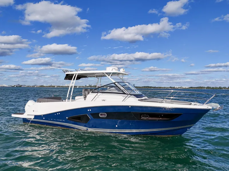 Slide: The Image of 2019 Jeanneau 34 boat on open water under a clear blue sky. - 2