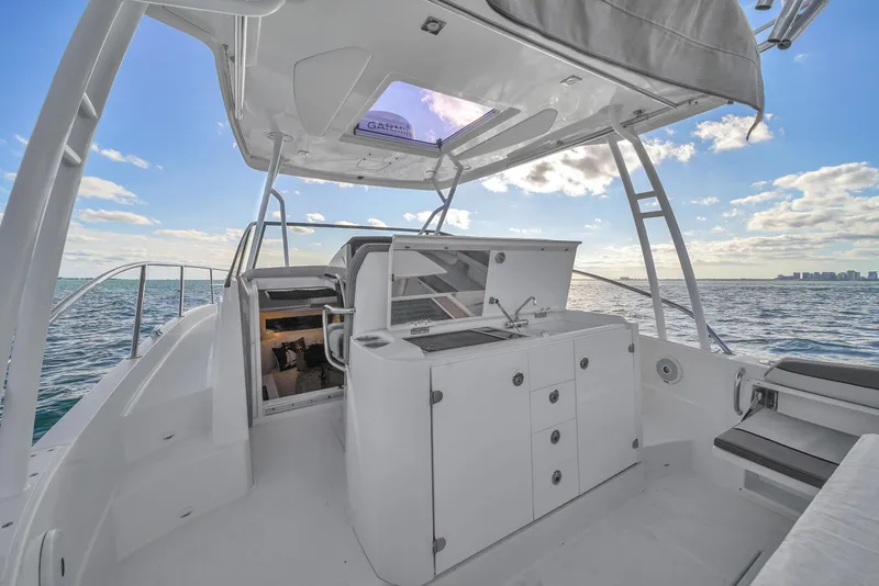 Slide: The Image of 2019 Jeanneau 34 boat interior with ocean view, featuring sleek design and modern amenities. - 20