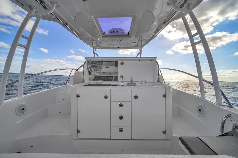 Slide: The Image of 2019 Jeanneau 34 boat interior with ocean view and modern amenities. - 21