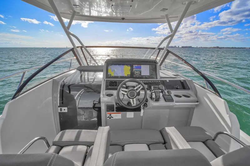 Slide: The Image of 2019 Jeanneau 34 yacht helm with ocean view and modern navigation equipment. - 27