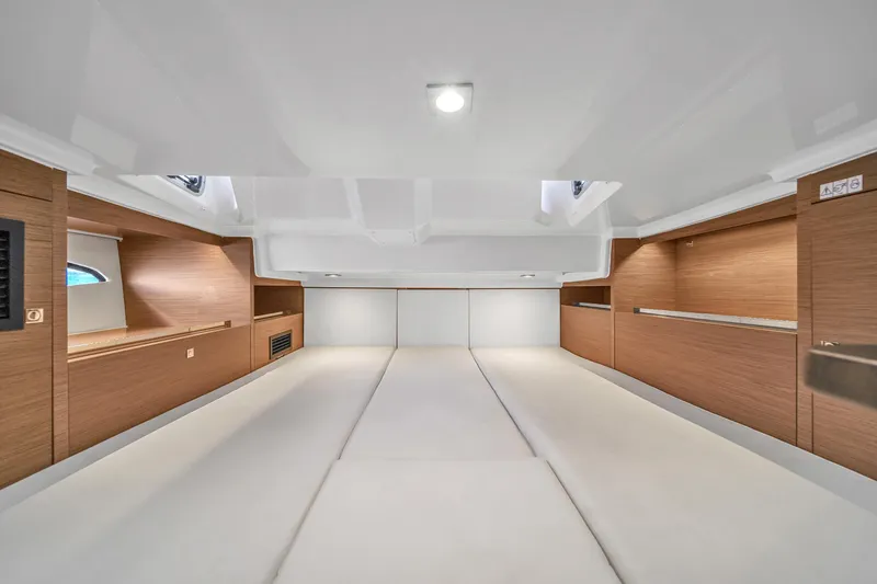 Slide: The Image of Spacious interior cabin of 2019 Jeanneau 34 yacht with modern wood finish. - 35