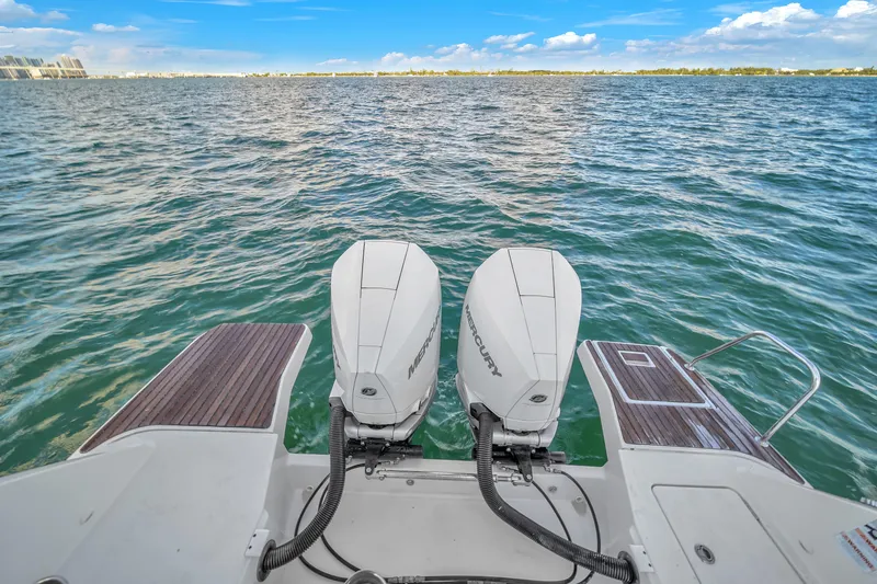 Slide: The Image of 2019 Jeanneau 34 boat with twin Mercury outboard engines on open water. - 40