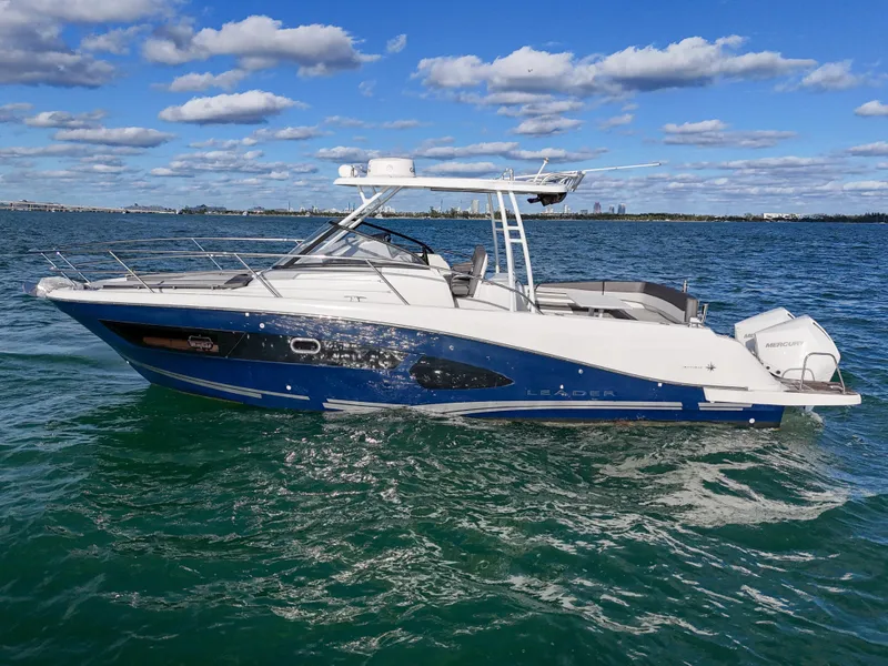 Slide: The Image of 2019 Jeanneau 34 boat on open water under blue sky. - 8