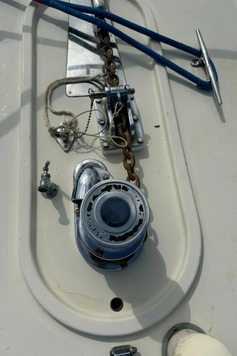 Slide: The Image of 2003 Dettling 51 Express Cruiser deck with anchor chain and winch. - 17