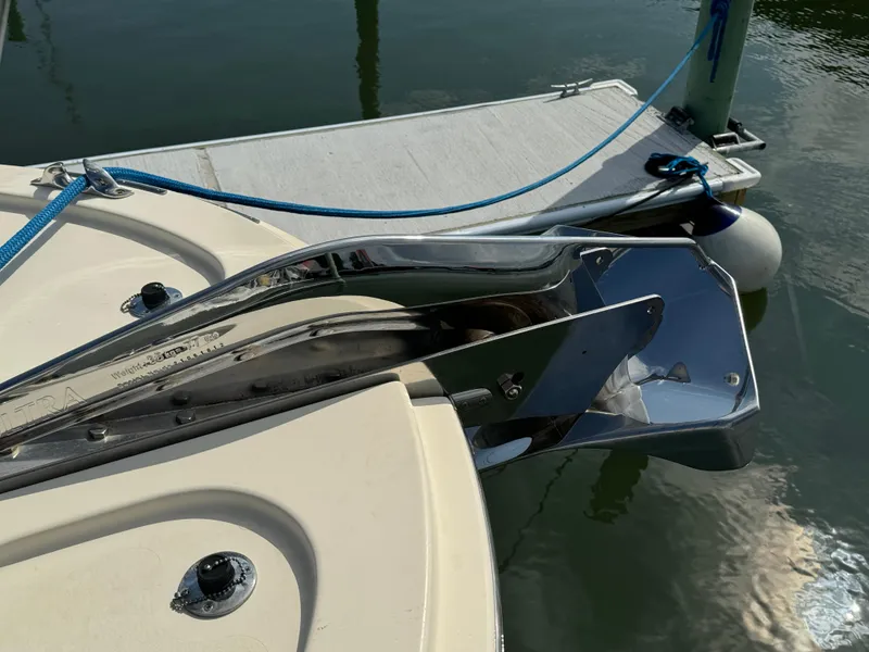 Slide: The Image of Bow of 2003 Dettling 51 Express Cruiser with anchor and docked at marina. - 18