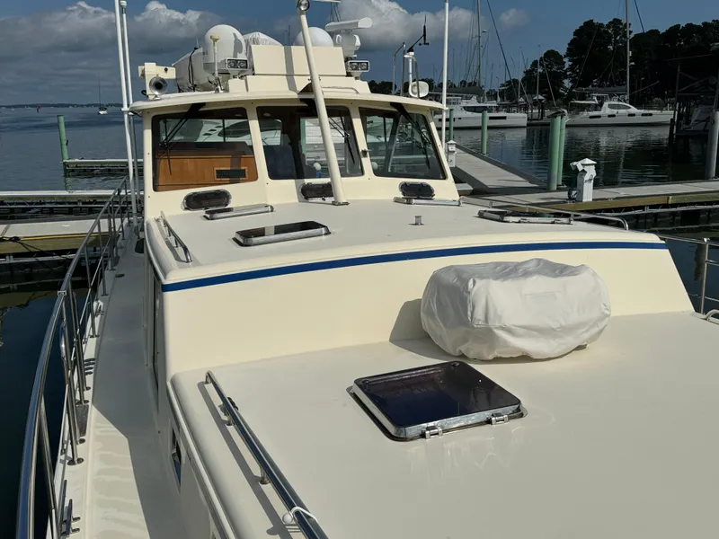 Slide: The Image of 2003 Dettling 51 Express Cruiser docked at marina, showcasing deck and cabin features. - 20