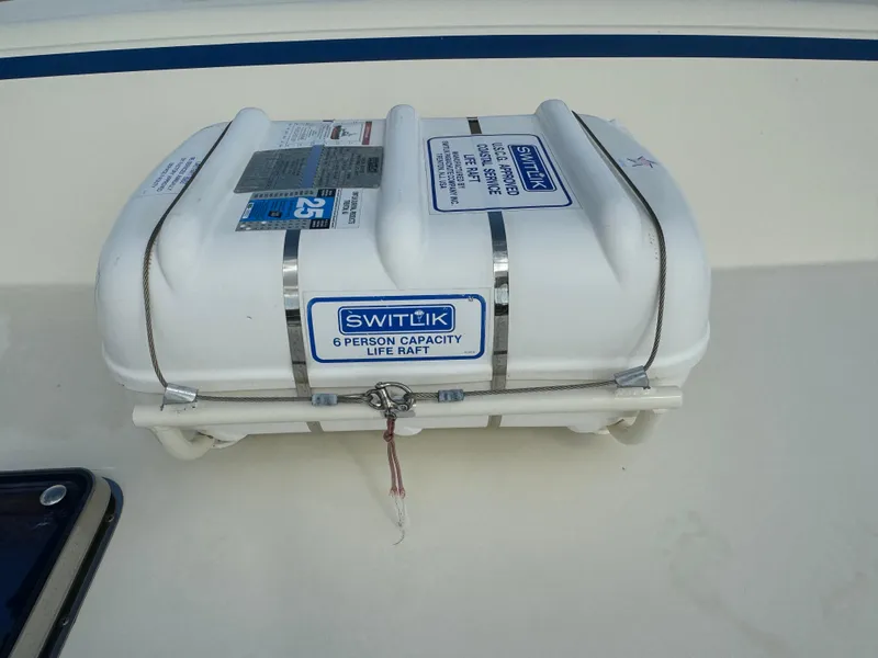 Slide: The Image of Switlik 6-person life raft on 2003 Dettling 51 Express Cruiser deck. - 21