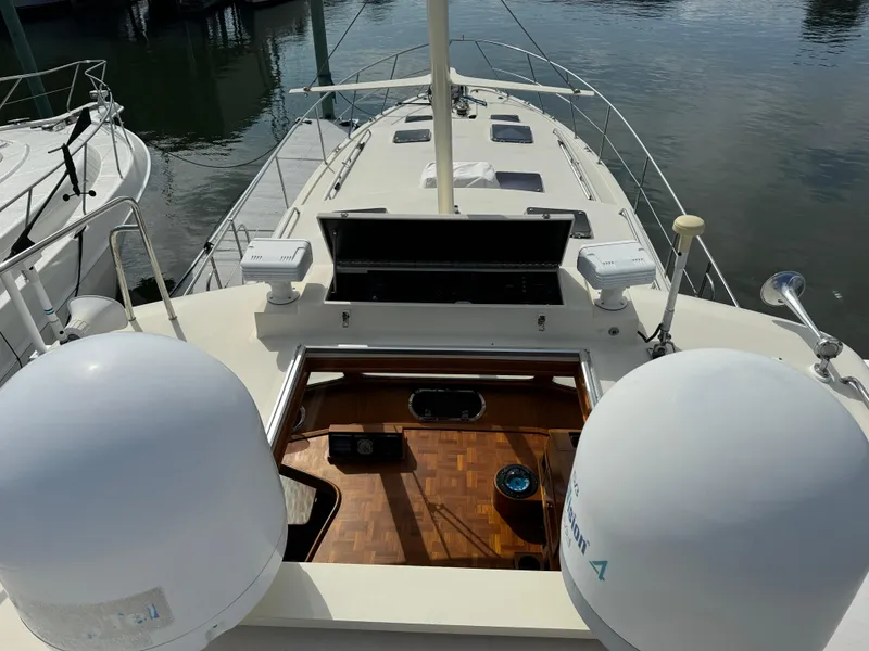 Slide: The Image of 2003 Dettling 51 Express Cruiser, top deck view with open hatch and radar domes. - 24