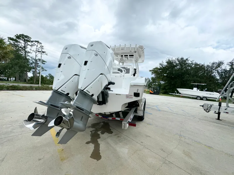 Slide: The Image of 2025 Fountain 34TE boat with dual outboard motors on a trailer. - 15