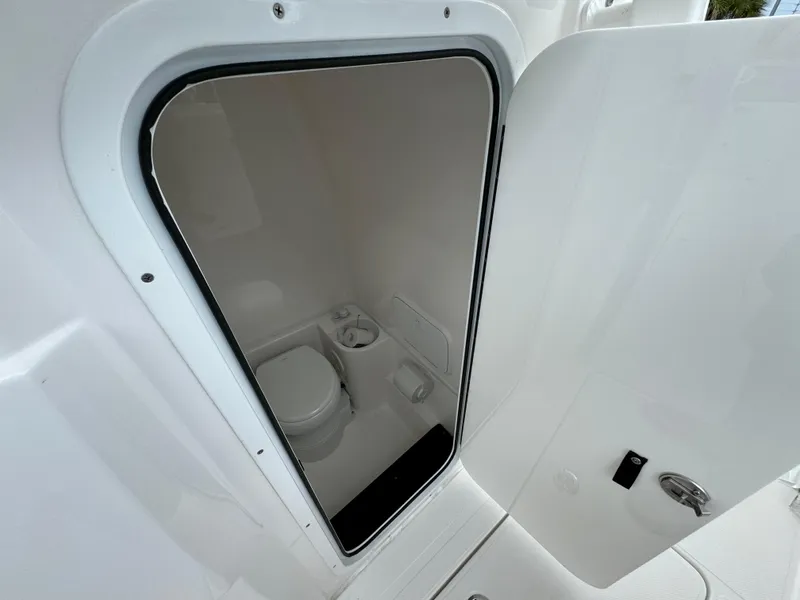 Slide: The Image of Fountain 34TE 2025 boat interior bathroom with toilet and sink. - 25
