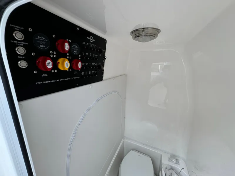 Slide: The Image of 2025 Fountain 34TE boat interior with control panel and toilet. - 27