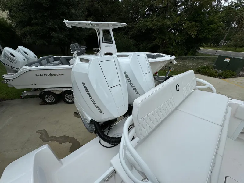 Slide: The Image of 2025 Fountain 34TE boat with Mercury engines, parked on a trailer. - 38