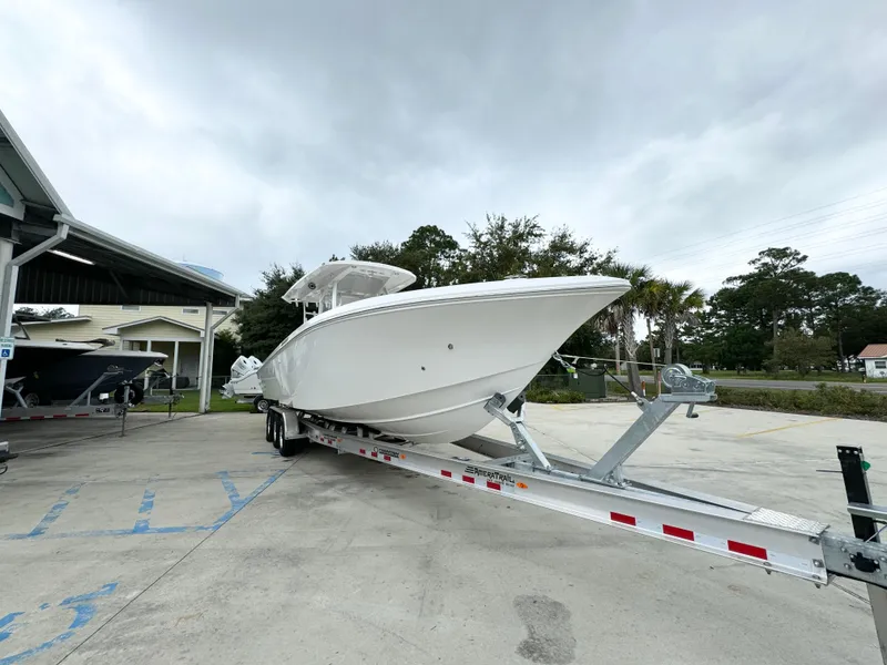 Slide: The Image of 2025 Fountain 34TE boat on trailer in outdoor setting. - 7