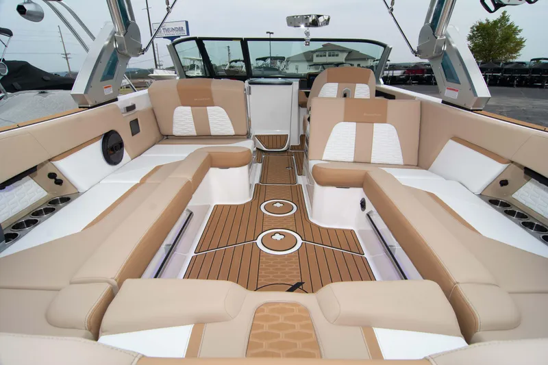 Slide: The Image of Luxurious interior of 2025 MasterCraft X26 boat with beige and white seating. - 18