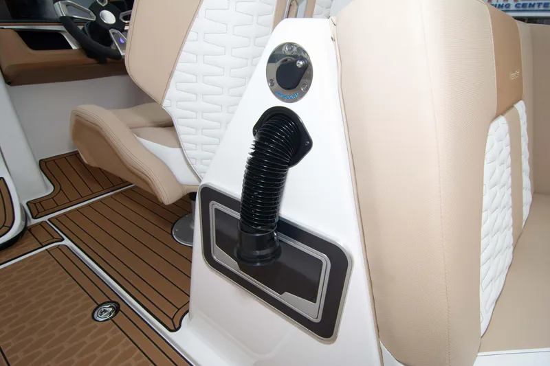Slide: The Image of 2025 MasterCraft X26 interior with beige seating and wood-style flooring. - 30
