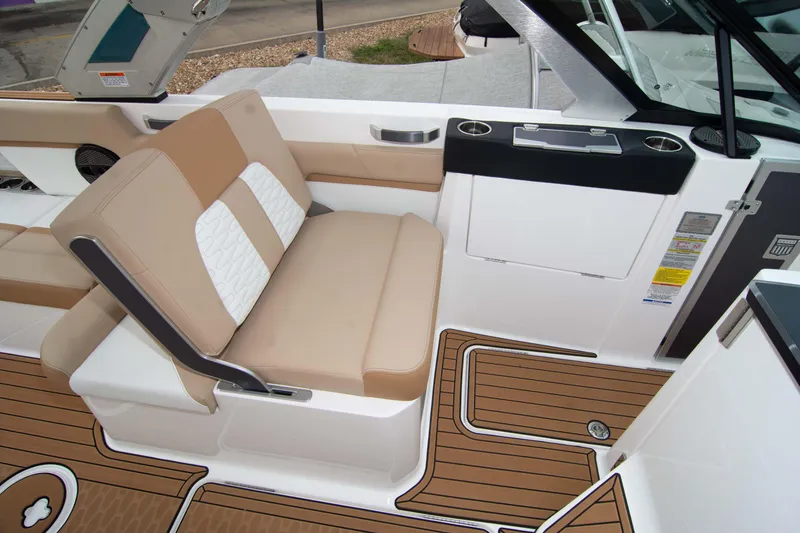 Slide: The Image of 2025 MasterCraft X26 interior with beige seating and teak flooring. - 45
