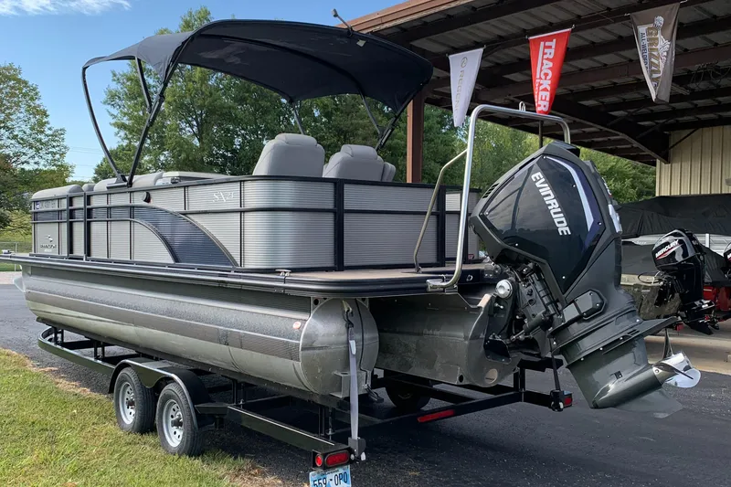 Slide: The Image of 2020 Bennington SXP 23 SBRXP pontoon boat with Evinrude motor on trailer. - 3