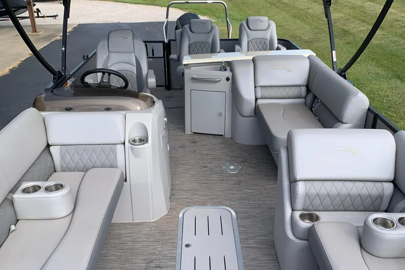 Slide: The Image of 2020 Bennington SXP 23 SBRXP pontoon boat interior with luxurious seating and modern design. - 5