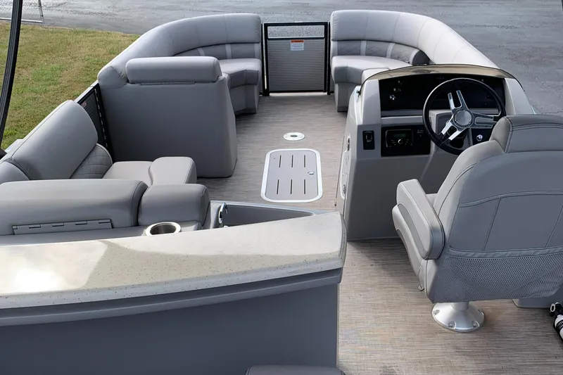 Slide: The Image of 2020 Bennington SXP 23 SBRXP pontoon boat interior with gray seating and steering console. - 7