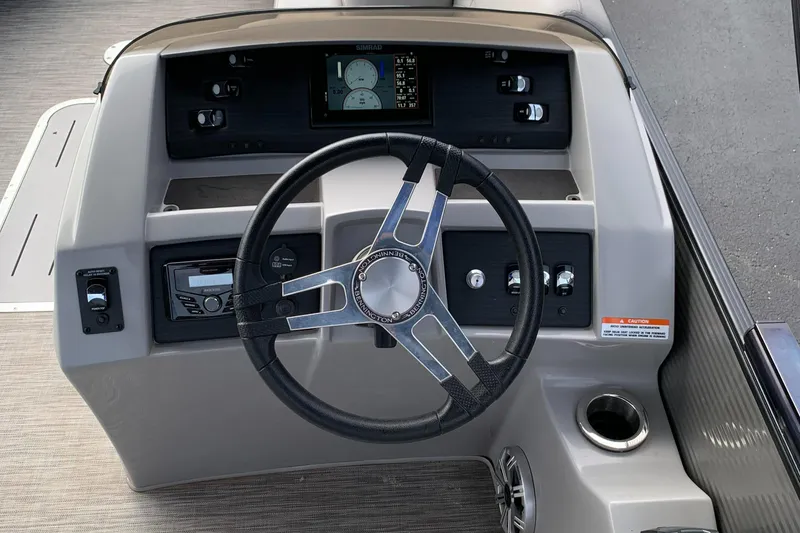 Slide: The Image of Steering console of 2020 Bennington SXP 23 SBRXP pontoon boat with modern controls. - 8