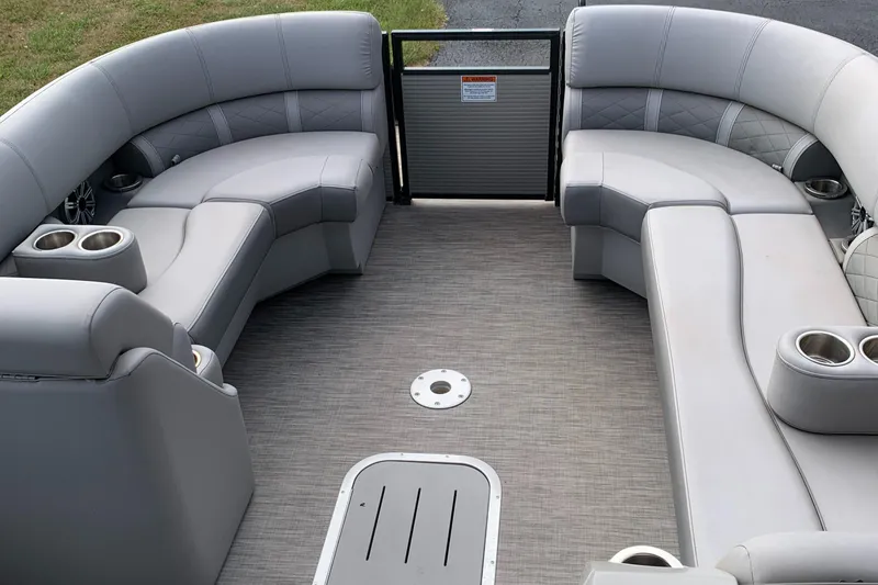 Slide: The Image of 2020 Bennington SXP 23 SBRXP pontoon boat interior with gray seating and cup holders. - 9