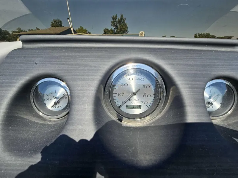 Slide: The Image of Dashboard gauges of a 2023 Bennington 24 SSR boat under sunlight. - 6