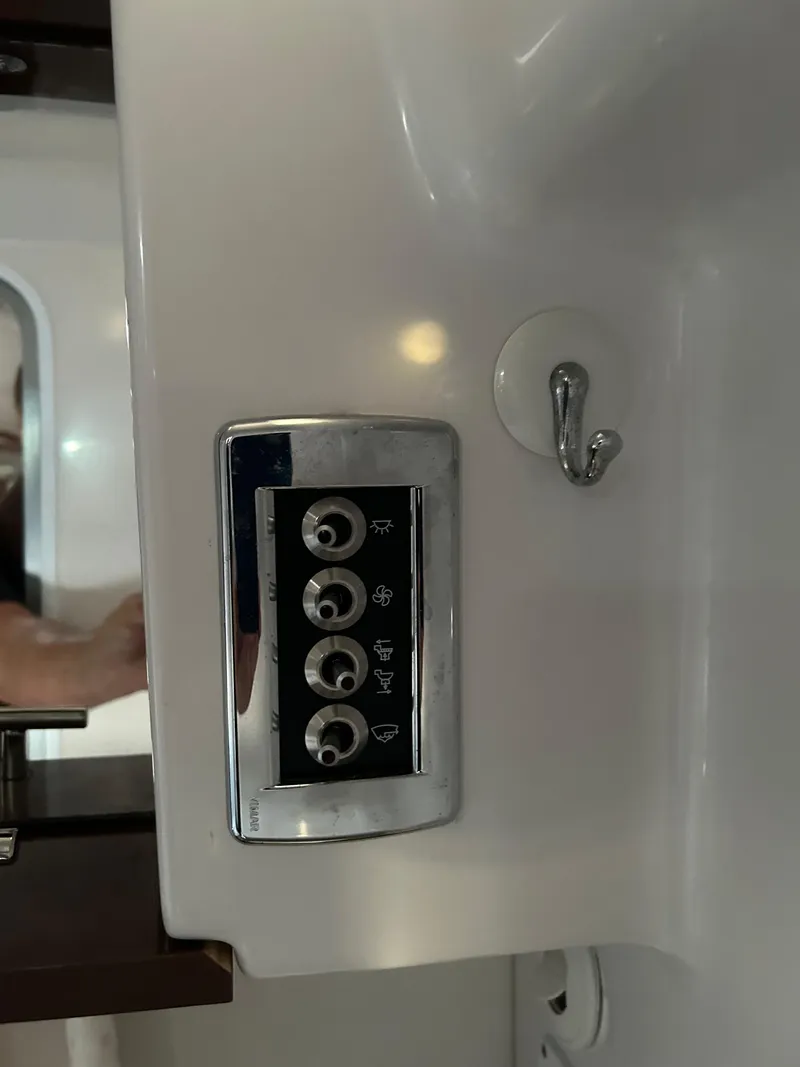 Slide: The Image of Control panel on 2014 Four Winns Vista 275 boat interior. - 12