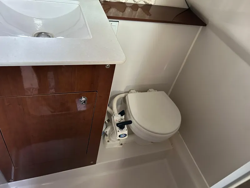 Slide: The Image of 2014 Four Winns Vista 275 bathroom with sink and toilet. - 13