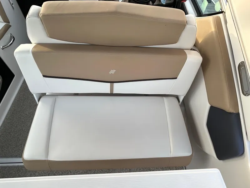 Slide: The Image of 2014 Four Winns Vista 275 boat seating, featuring beige and white upholstery. - 22