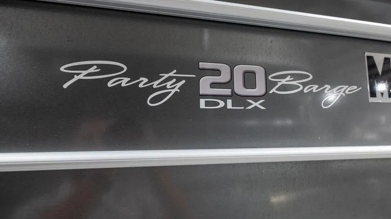 Slide: The Image of 2021 Sun Tracker Party Barge 20 DLX logo on dark background. - 15