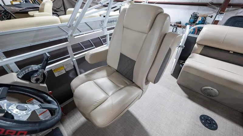 Slide: The Image of Captain's chair on 2021 Sun Tracker Party Barge 20 DLX pontoon boat interior. - 17