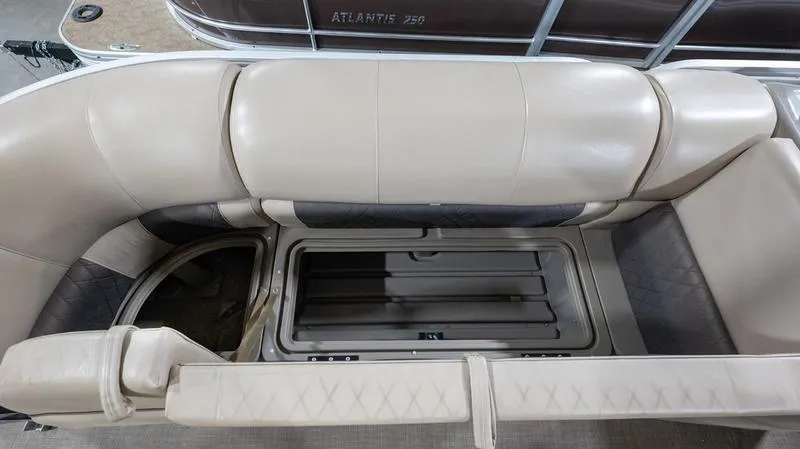 Slide: The Image of 2021 Sun Tracker Party Barge 20 DLX seating with storage compartment open. - 9
