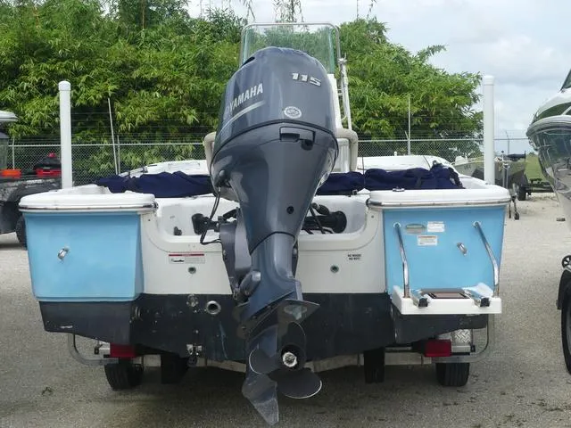 Slide: The Image of 2016 Sea Fox 200 Viper boat with Yamaha 115 outboard motor, parked outdoors. - 4