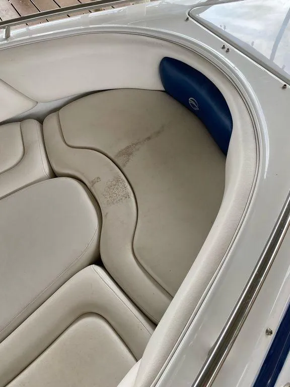 Slide: The Image of 2003 Crownline 270 BR boat interior with white and blue seating. - 18