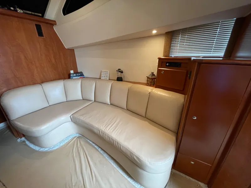 Slide: The Image of Luxurious interior of 2007 Silverton 330 Sport Bridge with cream leather seating. - 12