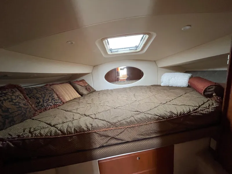Slide: The Image of 2007 Silverton 330 Sport Bridge cabin with cozy bed and skylight. - 15