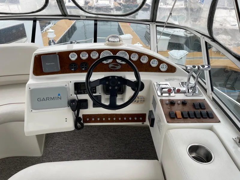Slide: The Image of 2007 Silverton 330 Sport Bridge helm with Garmin navigation and control panel. - 7