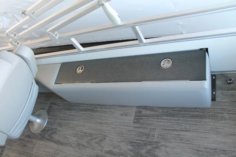 Slide: The Image of 2025 Ranger RP223FC boat interior with storage compartment and seating. - 12