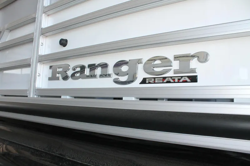 Slide: The Image of 2025 Ranger RP223FC boat logo on metallic surface. - 4