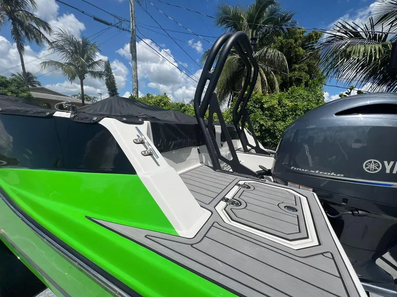 Slide: The Image of 2022 Starcraft SVX 191 OB boat with Yamaha engine, vibrant green and gray design. - 15