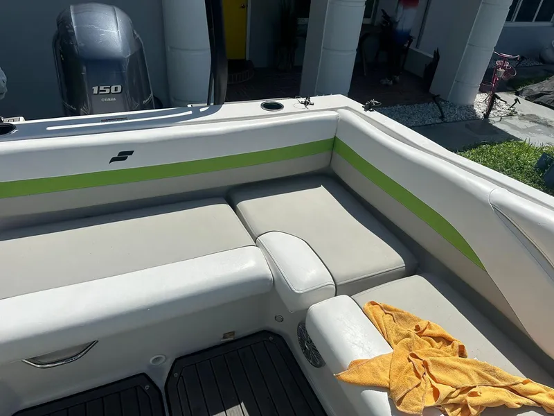 Slide: The Image of 2022 Starcraft SVX 191 OB boat interior with seating and Yamaha 150 engine. - 16