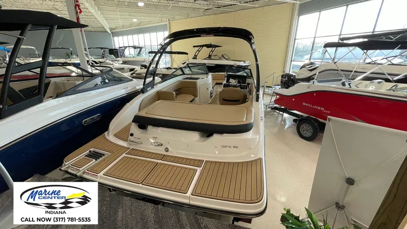 Slide: The Image of 2023 Sea Ray SPX 190 boat displayed at Marine Center Indiana showroom. - 17