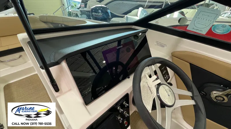 Slide: The Image of 2023 Sea Ray SPX 190 boat dashboard with steering wheel and controls. - 20