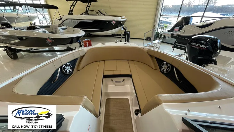 Slide: The Image of 2023 Sea Ray SPX 190 boat interior with tan seating, displayed at Marine Center Indiana. - 5